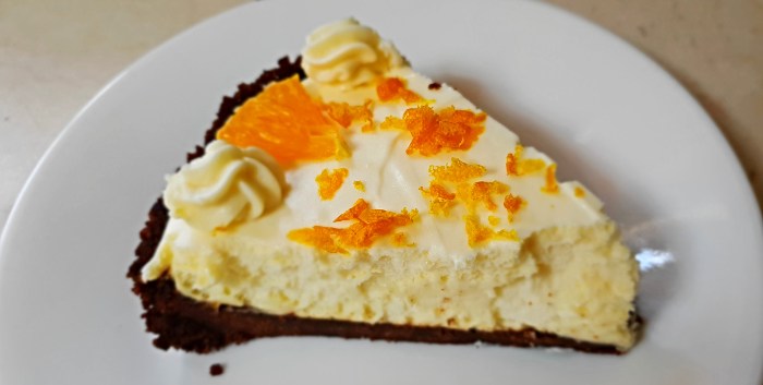 How to make the Worlds Best Cheesecake decorated with orange segments and a sprinkling of orange rind