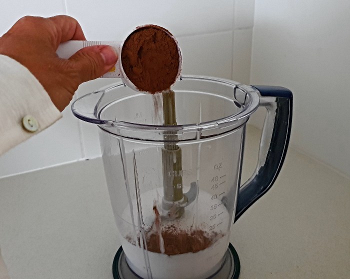 Adding the cocoa to the blender