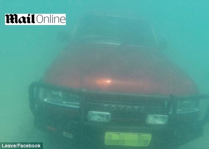 Snorkeler discovers a red Toyota Landcruiser sitting on the bottom of the ocean floor 