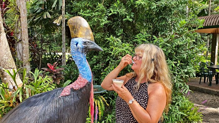 Adele eating her ice cream with the cassowary at Floravilla